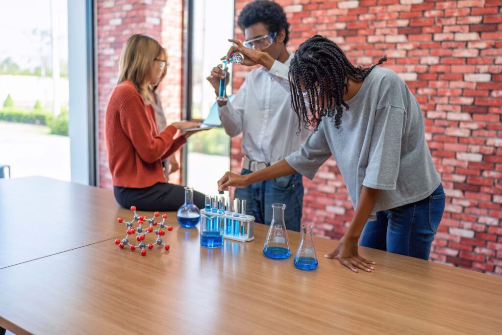 Teenager children learning with new innovation robotic hand interface hand control in classroom